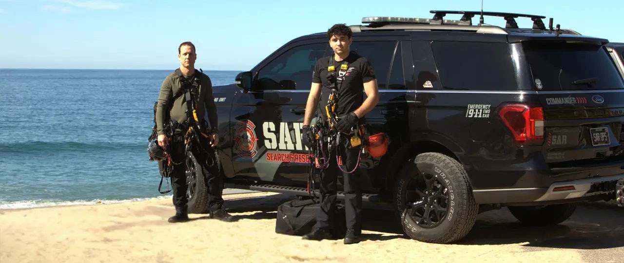 SAR OPS members with the command vehicle on the beach